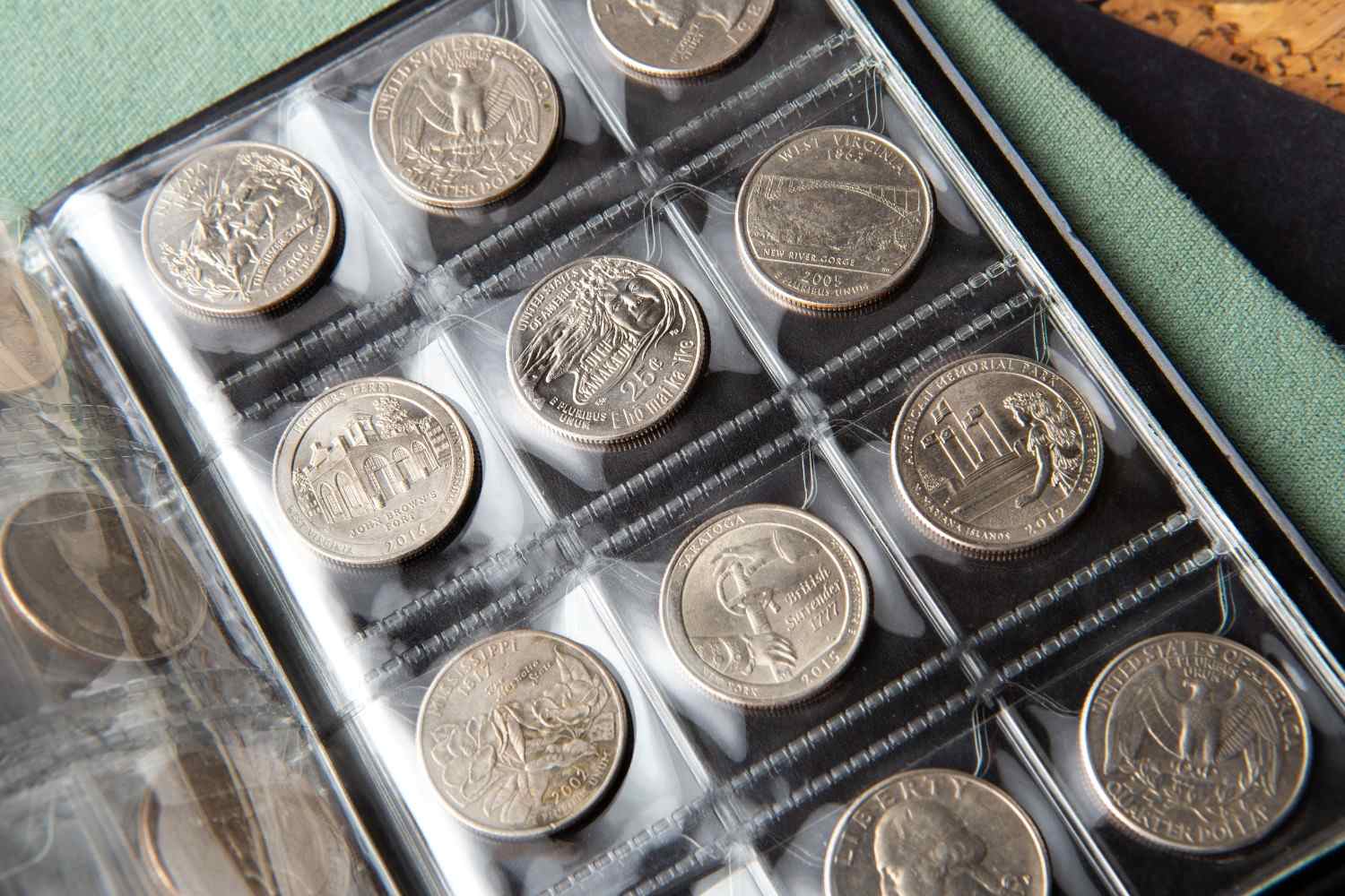 A collection of world coins organized in a display tray