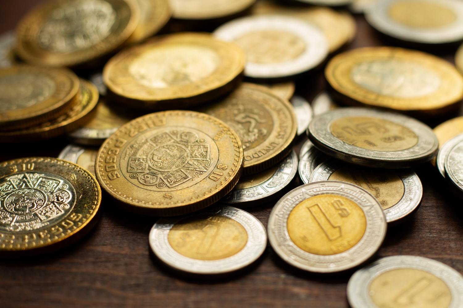 Certified coins displayed alongside older albums and boxes