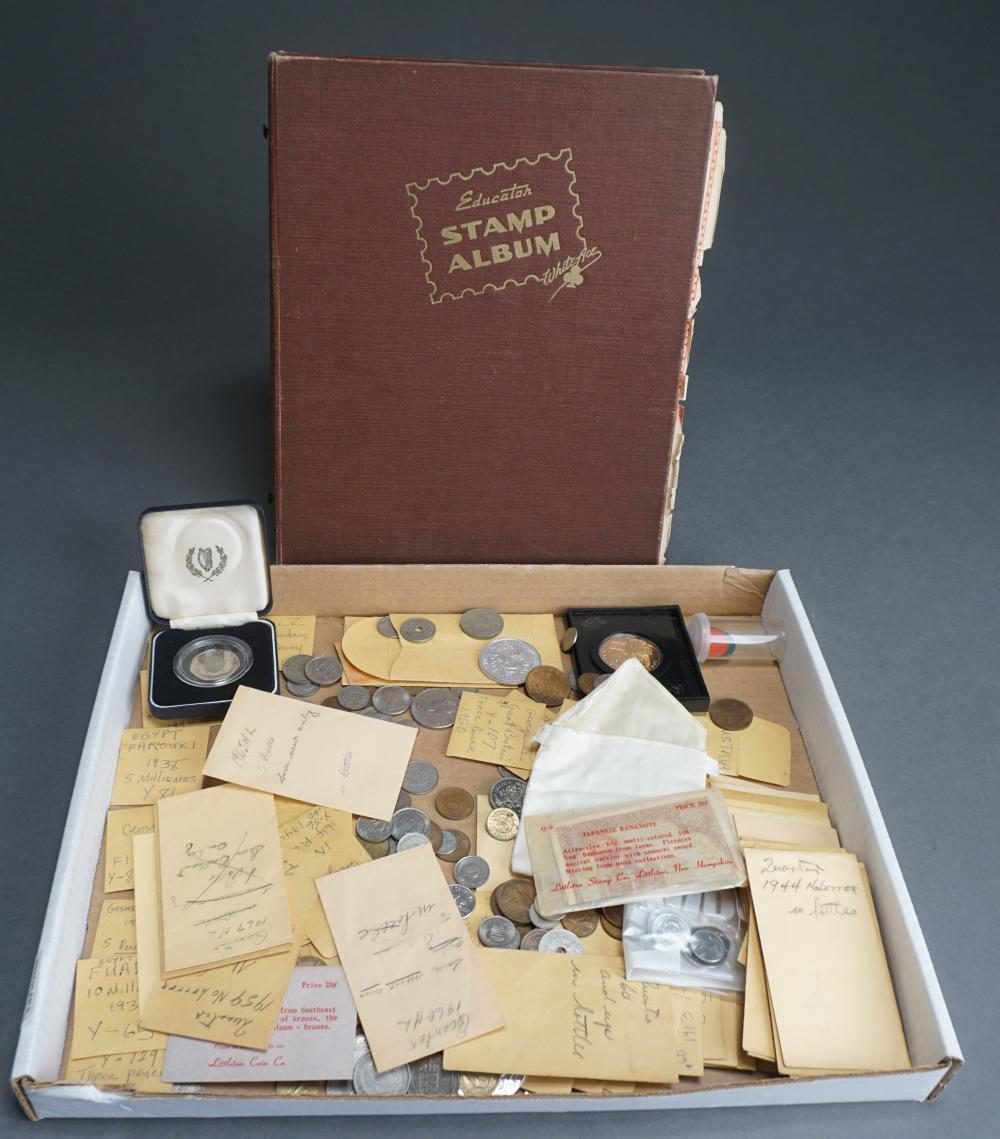 A stamp album and box of coins and envelopes from an estate collection