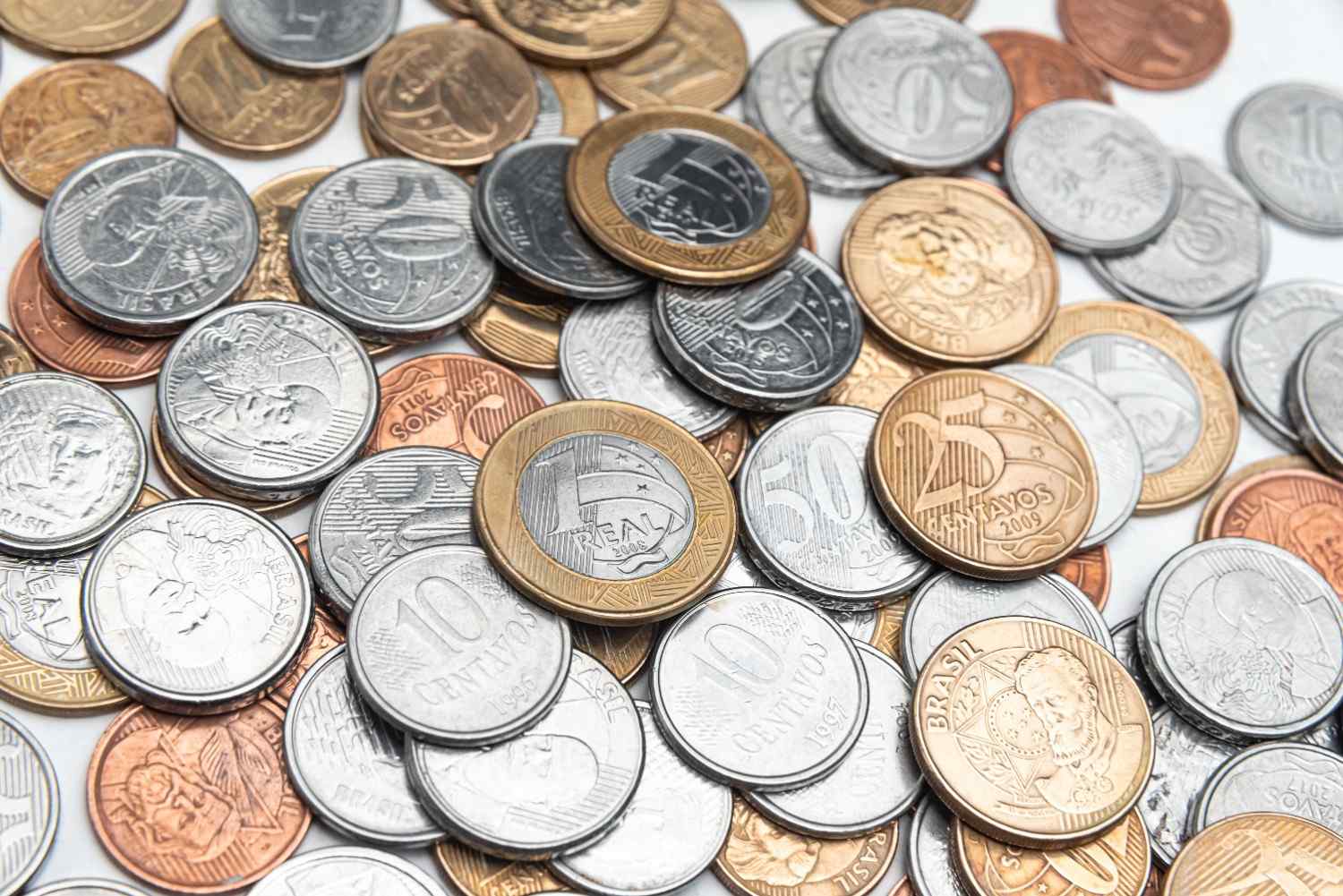 Certified coins displayed alongside older albums and boxes