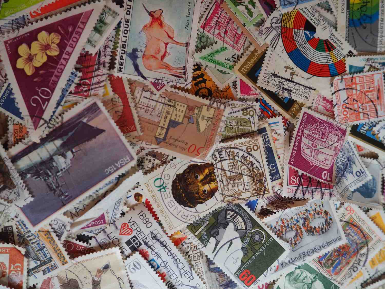 A stamp album alongside handwritten collector notes